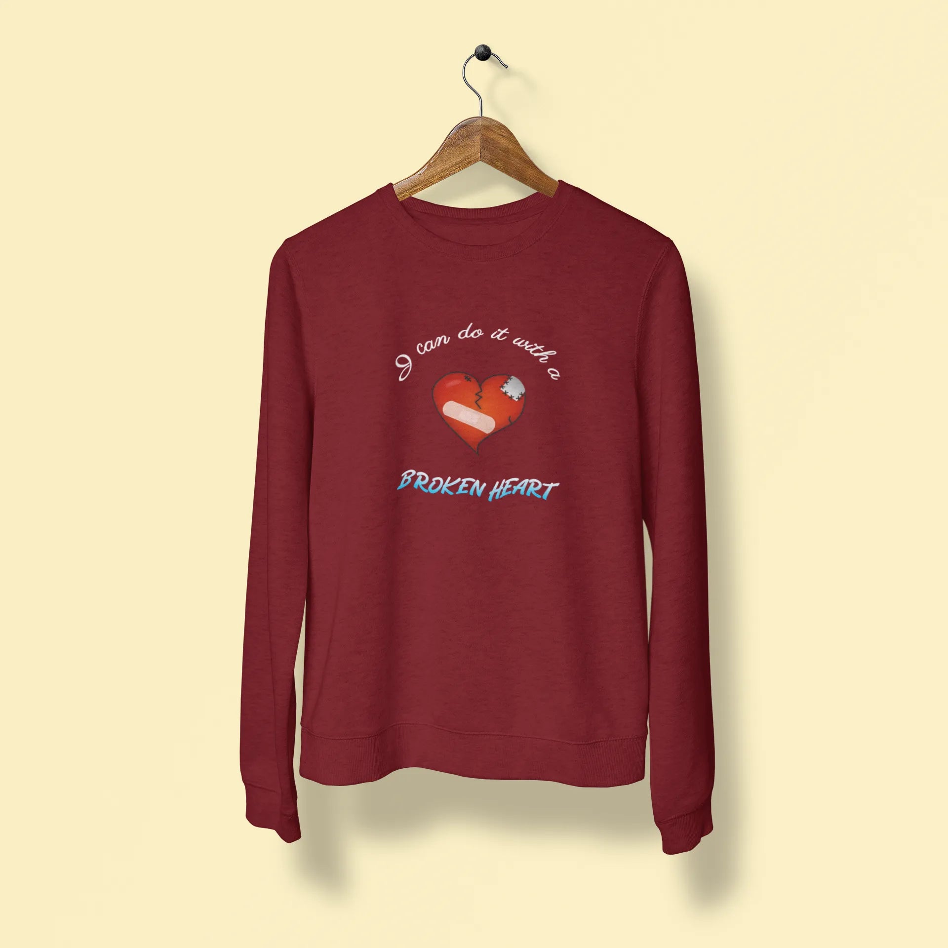 i can do it with a broken heart unisex sweatshirt maroon