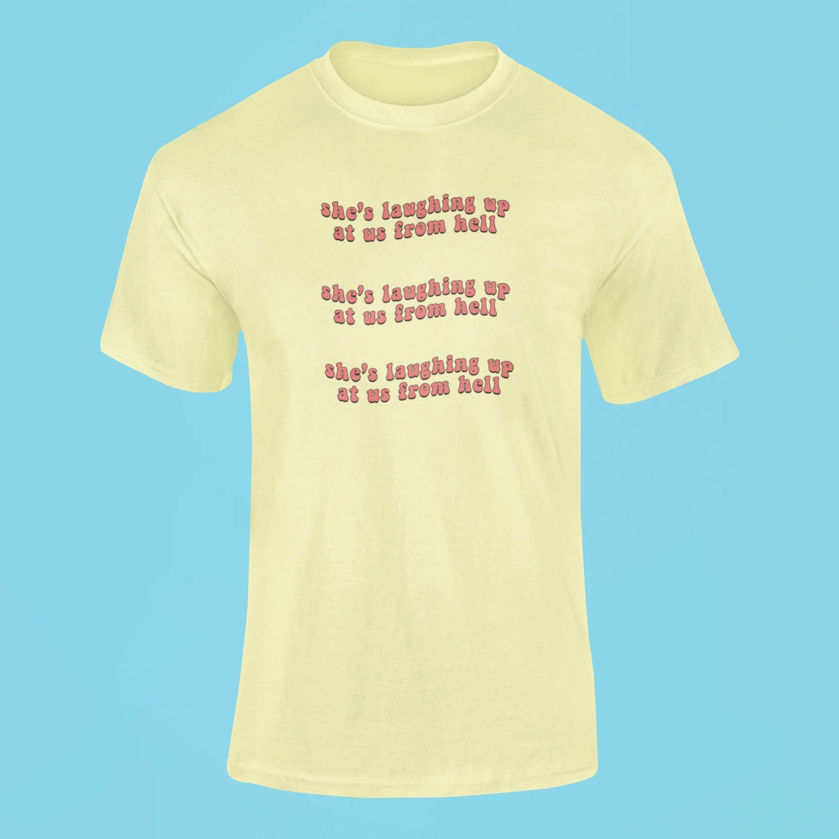 shes laughing up at us from hell t shirt butter yellow