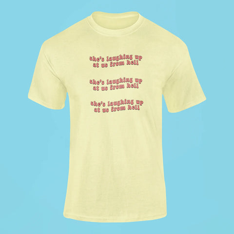 shes laughing up at us from hell t shirt butter yellow